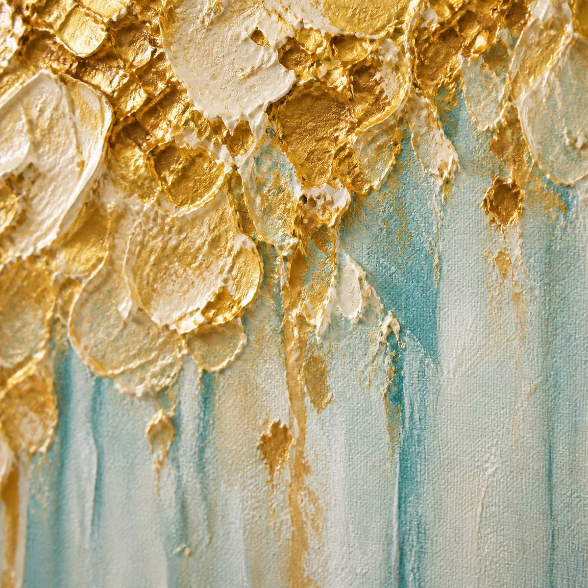 Close-up of gold and ivory impasto meeting translucent aqua paint drips.