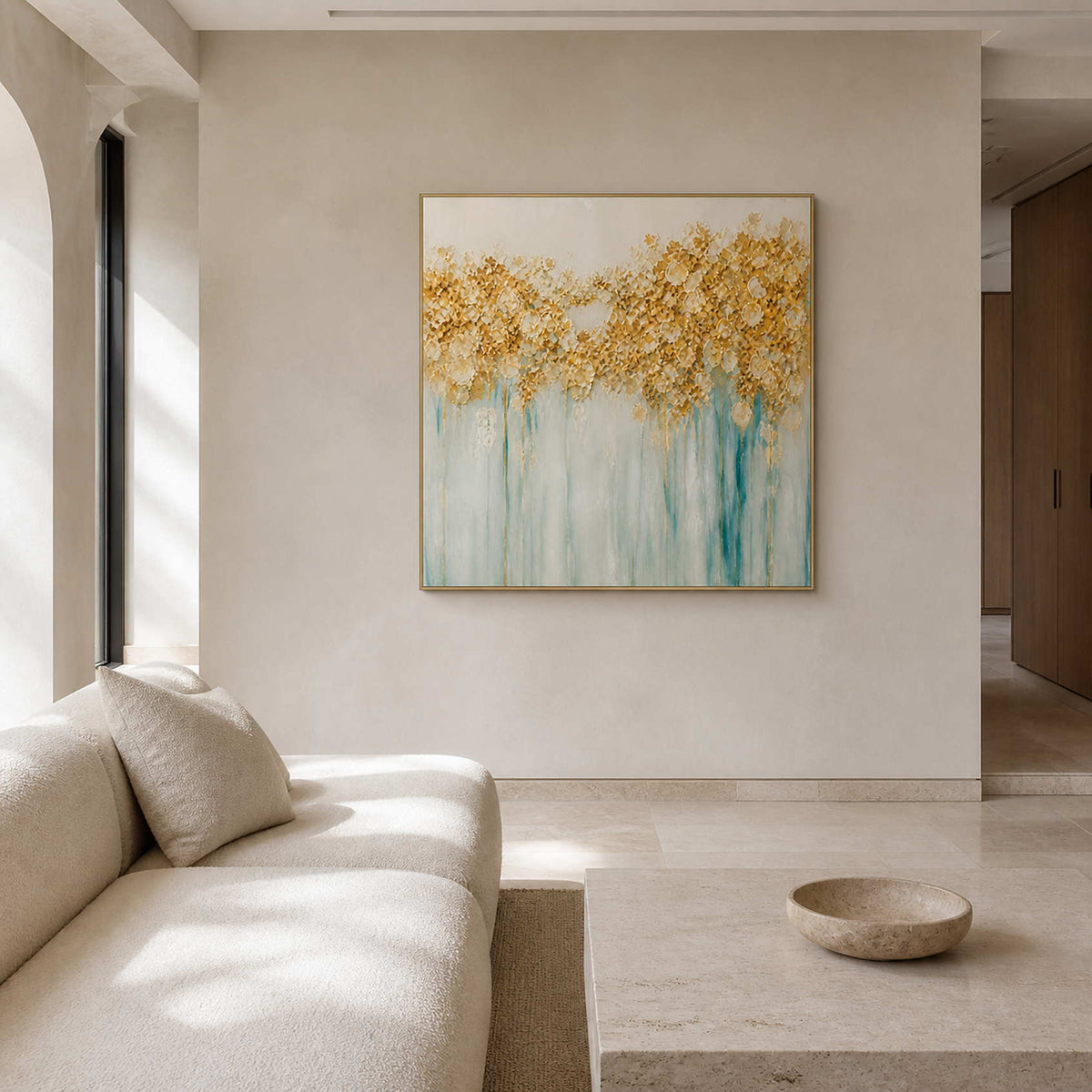 Gold and aqua floral wall art displayed in a warm ivory living room.
