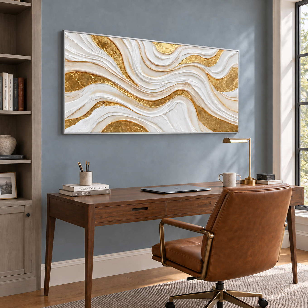 Golden Years in a silver frame above a wood desk and brown leather office chair against a blue-gray wall.