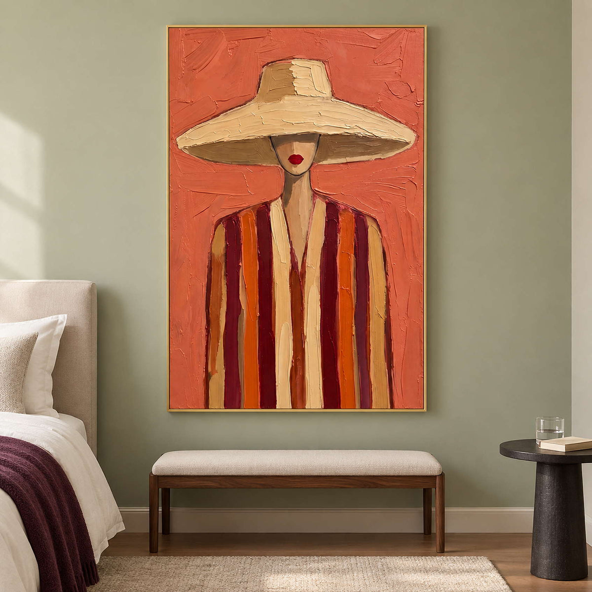 Cream-hat portrait above a beige bench on a green bedroom wall.