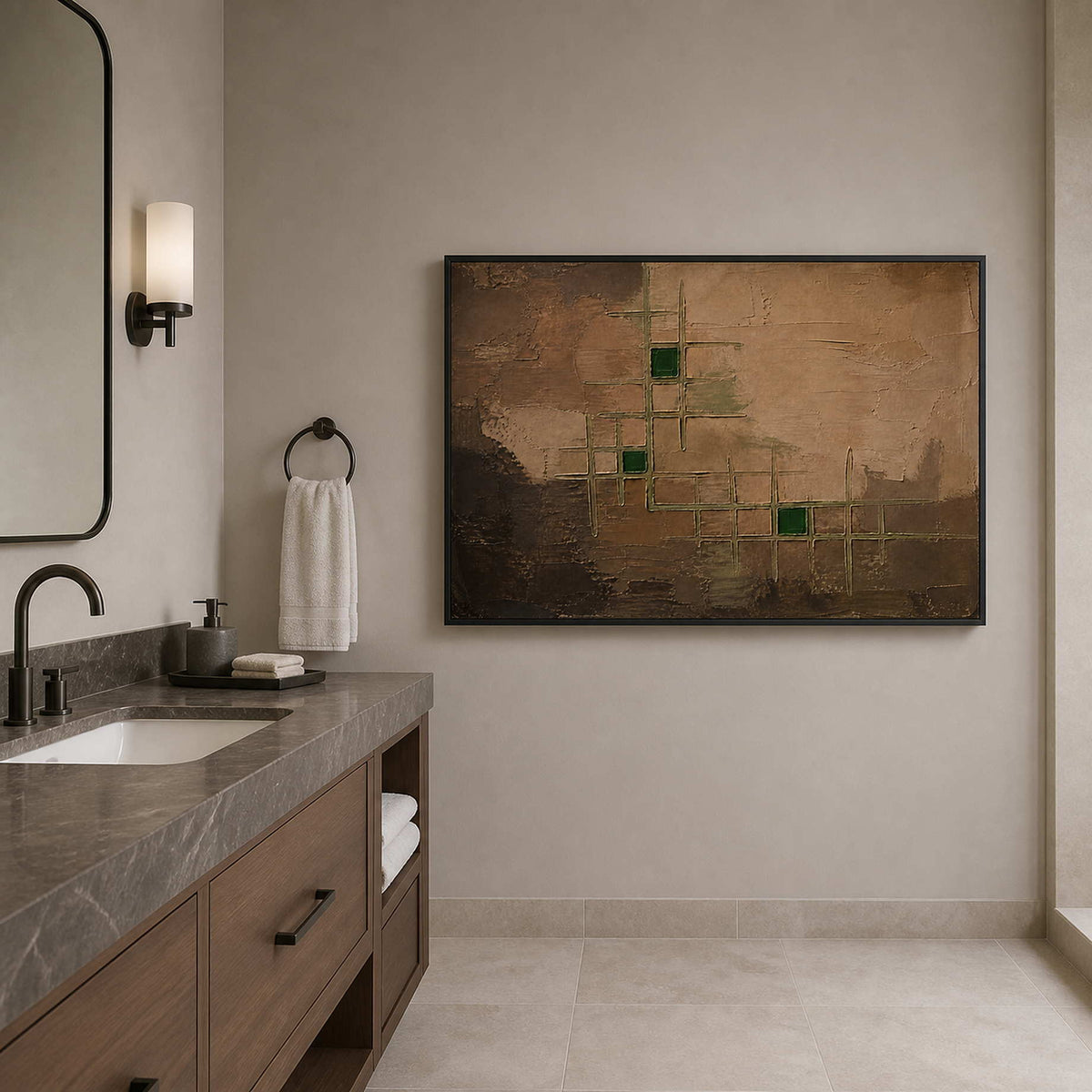 Brown and green wall art in a black frame near a bathroom vanity.