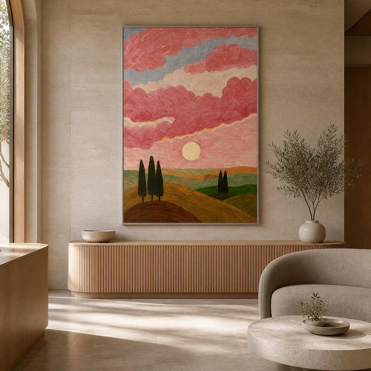 Silver framed landscape of rolling hills and a pale sun in a wellness reception.