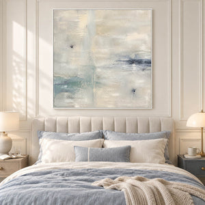 Square neutral abstract painting with ivory, pale aqua, and blue-gray marks in a white frame in a bedroom.