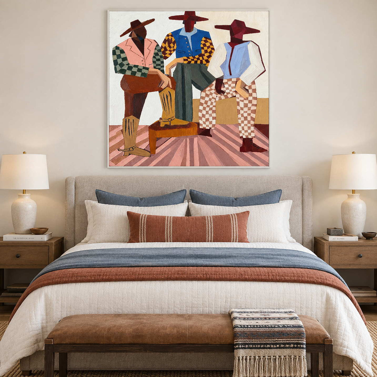 White-framed group portrait above a pale bed with blue and rust-colored bedding accents.