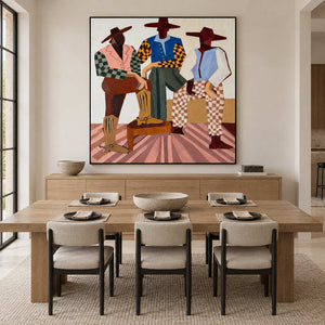 Colorful broad-hatted figures above a light wood dining sideboard and set dining table.