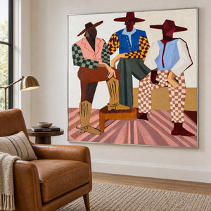 Angled view of the checked-clothing figures beside a brown leather reading chair.
