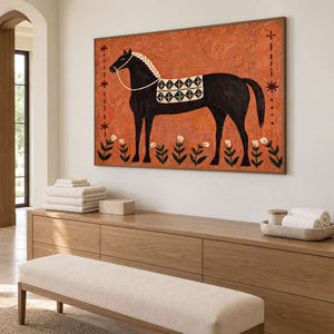 Wide horse painting above wooden cabinets holding folded towels.