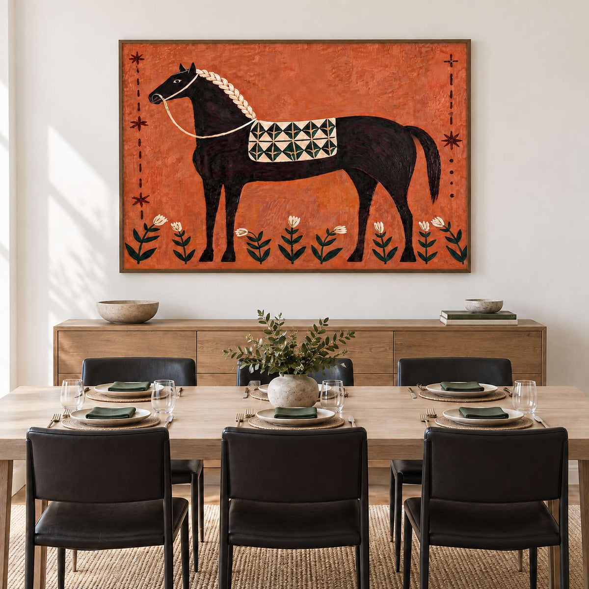 Wide black-horse artwork behind a dining table with black chairs.