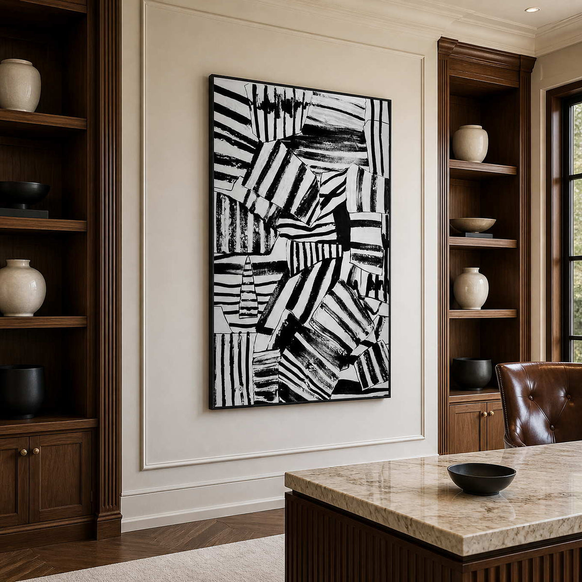 Black-framed striped abstract wall art beside a stone-topped desk in a wood-lined home office.