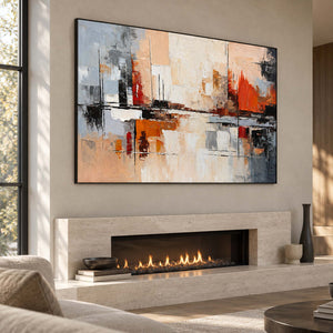 Angled view of the textured abstract artwork above a pale stone fireplace.