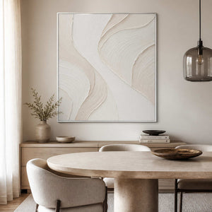 Vertical textured neutral wall art displayed in a light beige dining room.