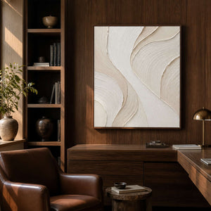 Cream sculptural wall art displayed in a walnut reading room.