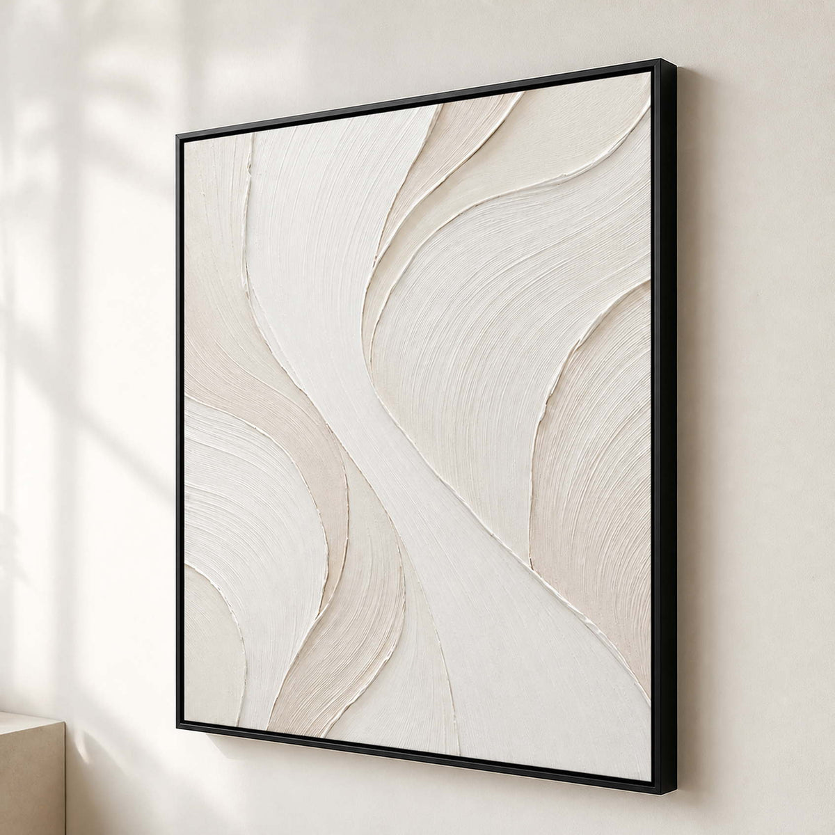 Textured ivory abstract wall art shown from the side on a warm white gallery wall.