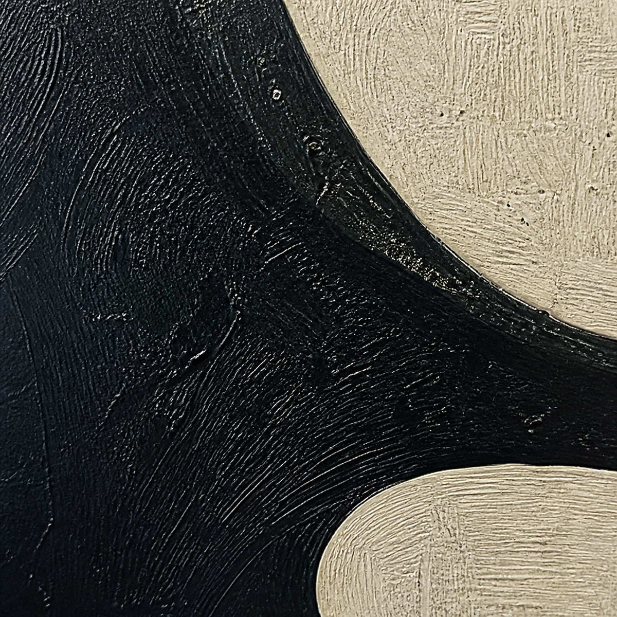 Close-up of fine black and ivory directional brushwork texture.