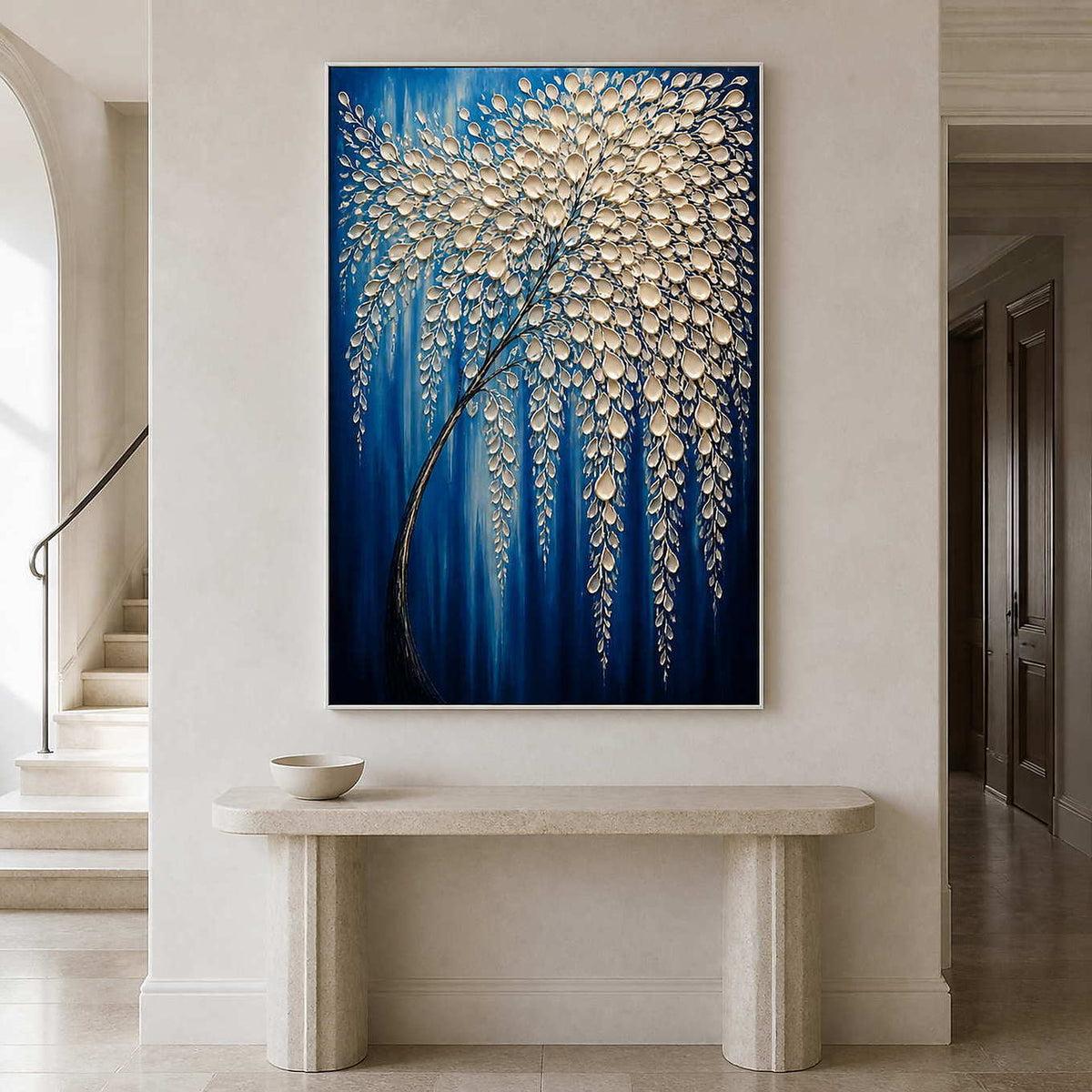 Vertical cobalt botanical painting above a pale stone entryway console.