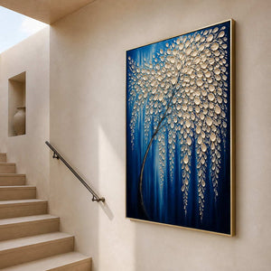 Tall cobalt floral canvas displayed beside a light wood staircase.