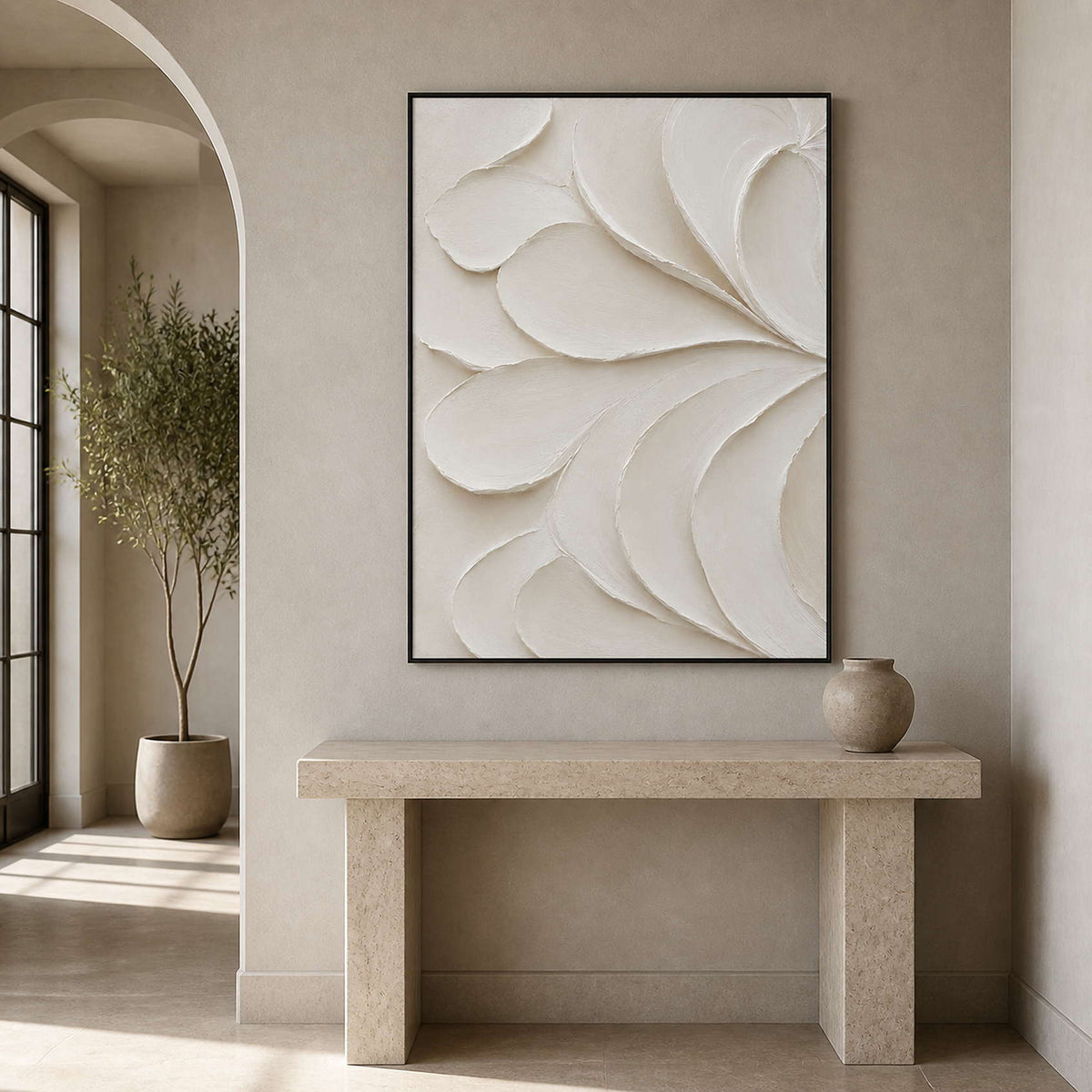 Textured white minimalist wall art displayed in a greige curved entryway.