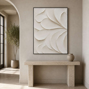 Textured white minimalist wall art displayed in a greige curved entryway.