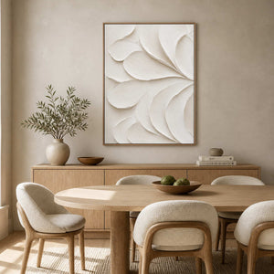 Vertical ivory abstract wall art displayed in a light oak dining room.