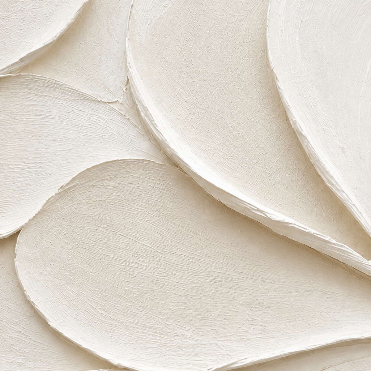 Close-up of layered ivory palette-knife edges and finely combed white paint texture.