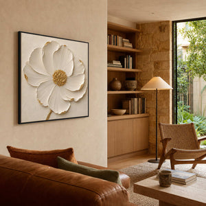 Sculptural ivory flower wall art displayed in a modern organic reading lounge.