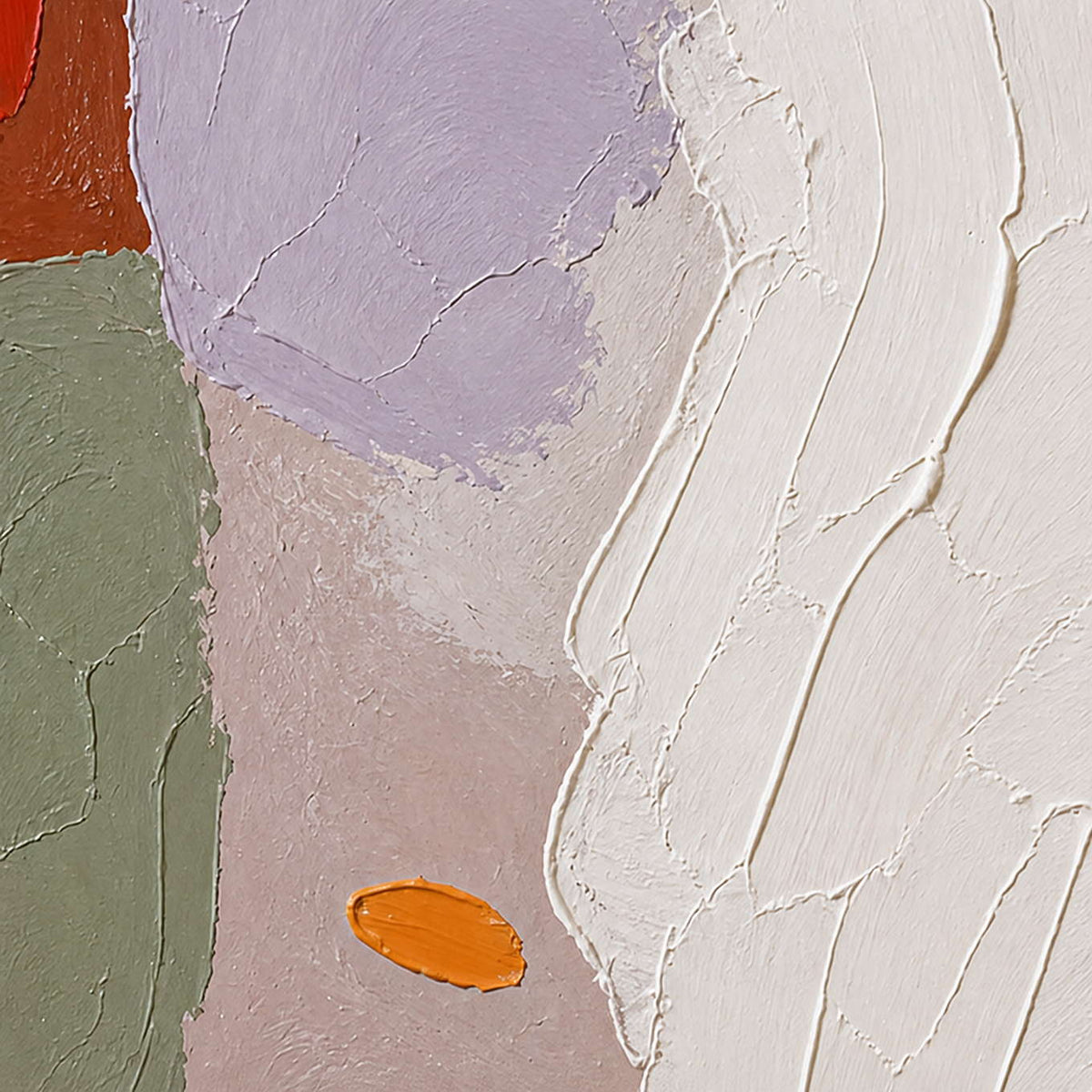 Close-up of ivory relief beside lilac, sage, and orange accents.