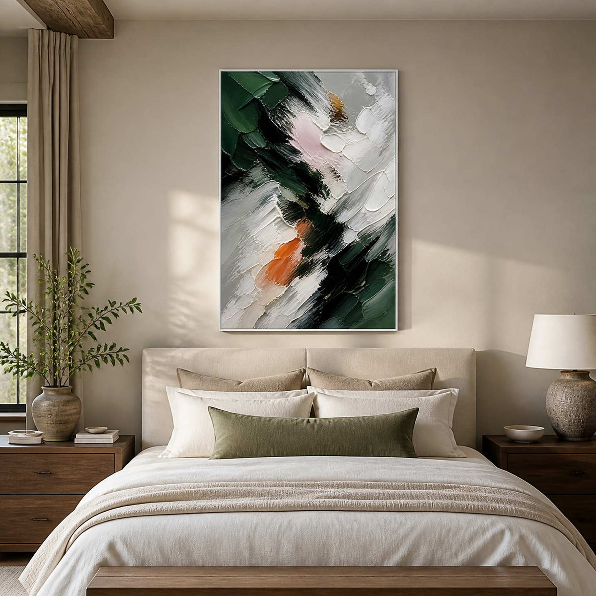 Deep green and ivory abstract canvas above a calm neutral bed.