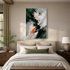 Deep green and ivory abstract canvas above a calm neutral bed.