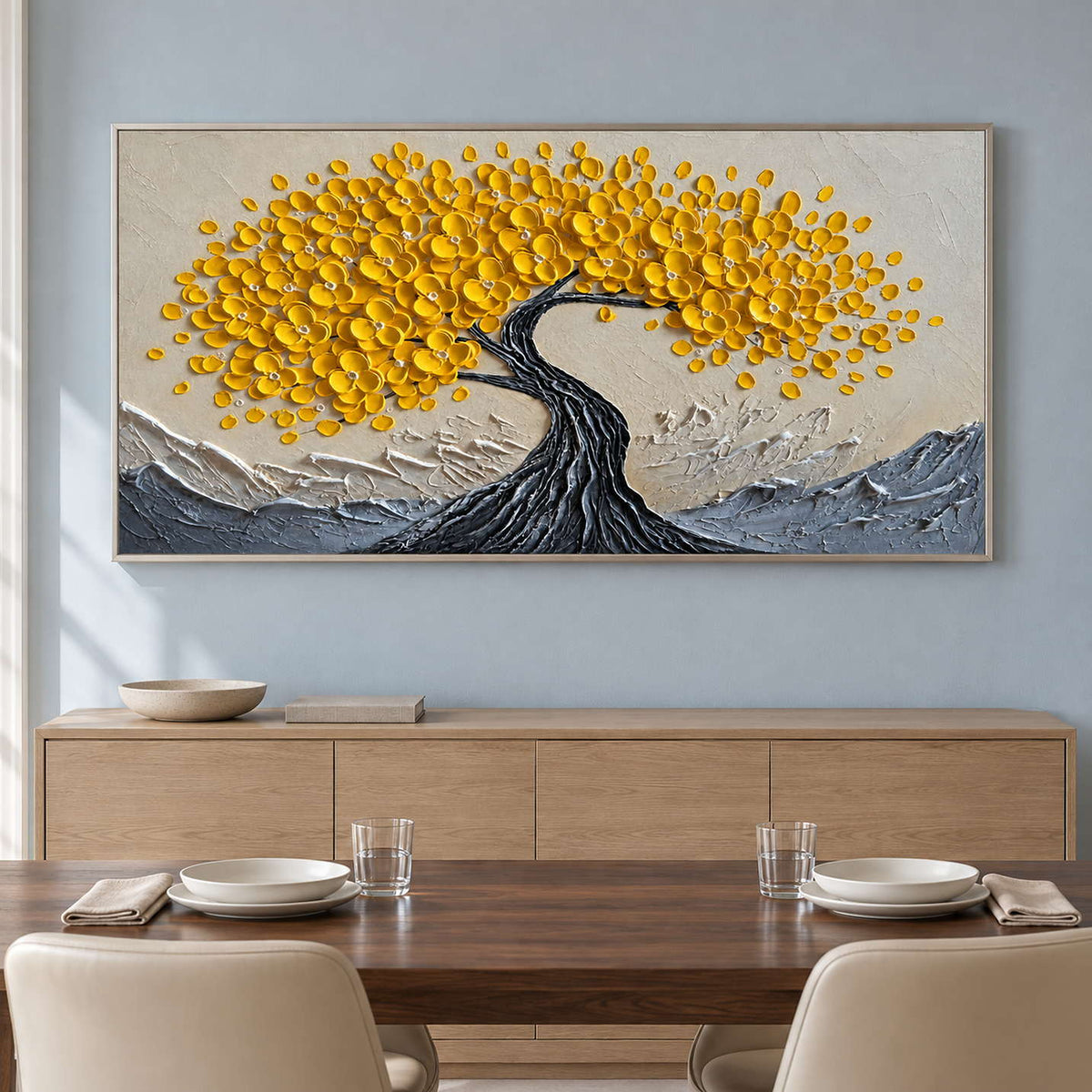 Wide yellow tree artwork on a blue dining room wall.