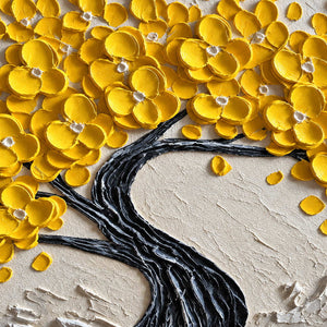 Detail of rounded yellow petals and the twisting dark trunk.