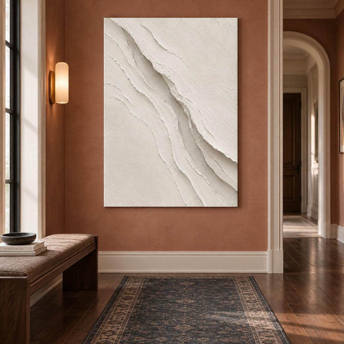 Hand-painted ivory abstract wall art with layered cream palette-knife relief, displayed in a hallway without an outer frame.