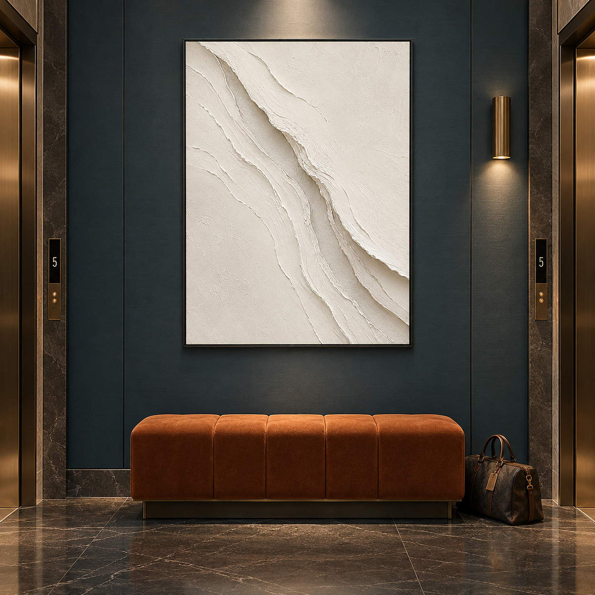 Hand-painted ivory abstract wall art with layered cream palette-knife relief, displayed in a hotel elevator lobby in a black frame.