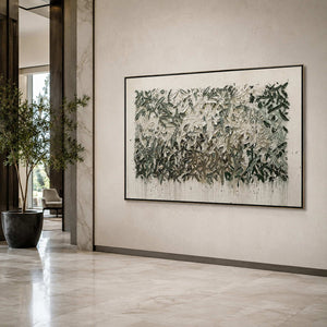 Textured botanical wall art displayed in a hotel lobby.