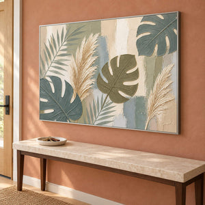 Sage leaves and ivory pampas grasses painting in a silver frame in an entryway.