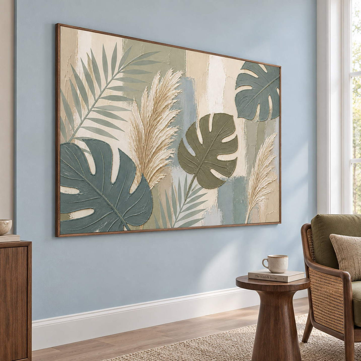 Sage leaves and ivory pampas grasses painting in a brown wood frame in a lounge.