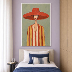 Tall hat portrait over a single cream bed with navy bedding against lavender.
