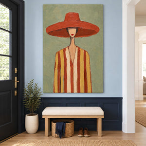 Striped figure painting over a pale bench above navy entryway paneling.
