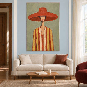 Terracotta-hat portrait above a cream loveseat with a small oval wooden coffee table.