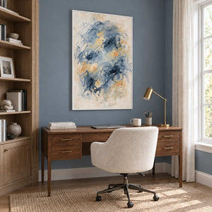 Let Your Thoughts Wander in a white frame above a wood desk and cream office chair against a blue-gray wall.