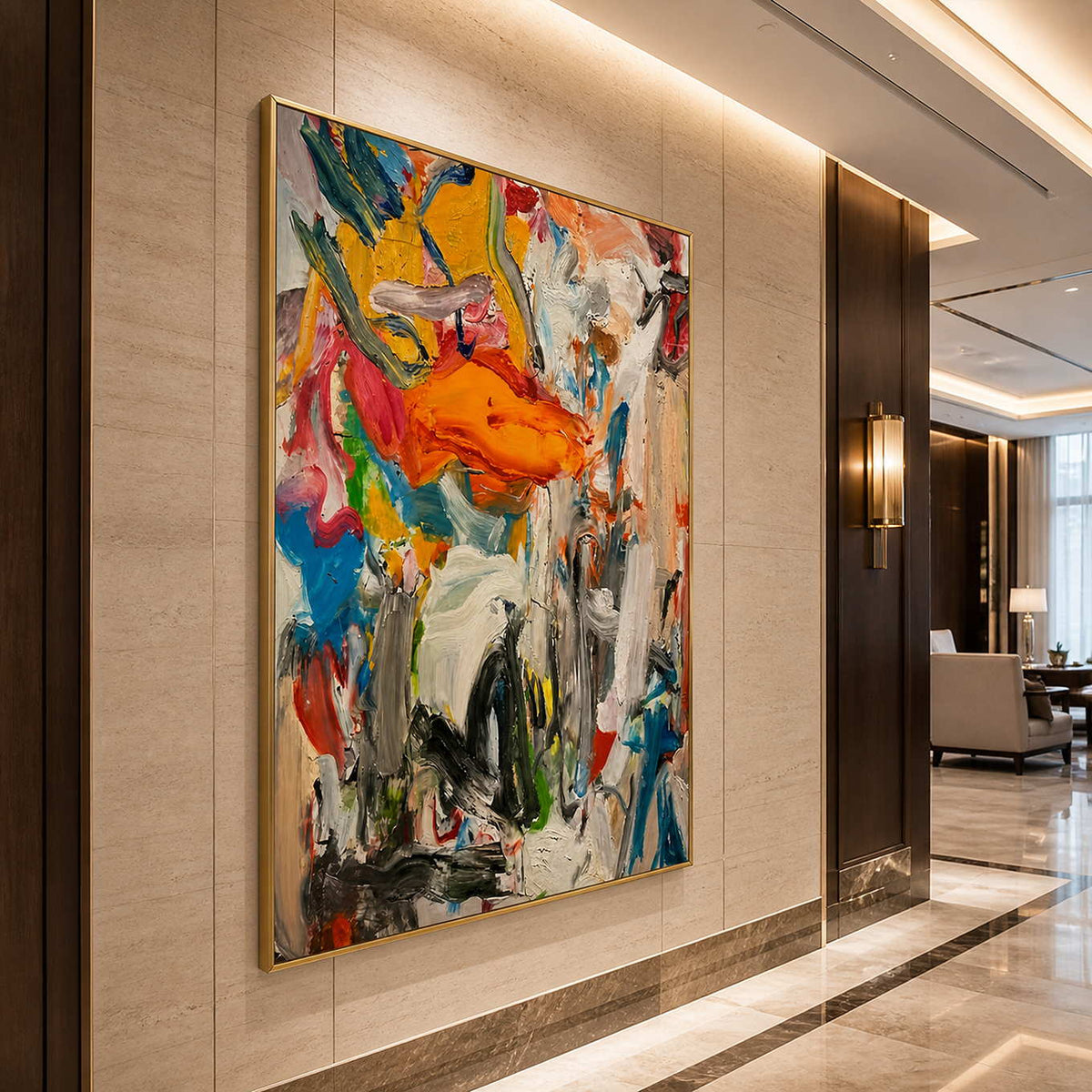 Gold framed energetic abstract artwork on a stone wall in a hotel lobby.