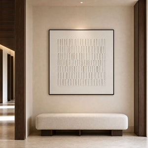 Square ivory artwork in a serene boutique hotel corridor niche.