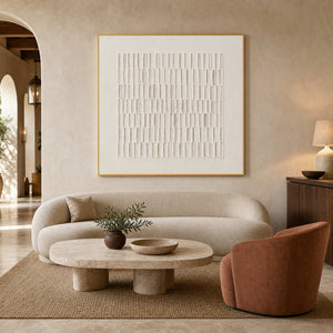 Textured neutral wall art in a modern Mediterranean hotel lobby.