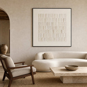 Ivory textured relief artwork in a sculptural Mediterranean living room.