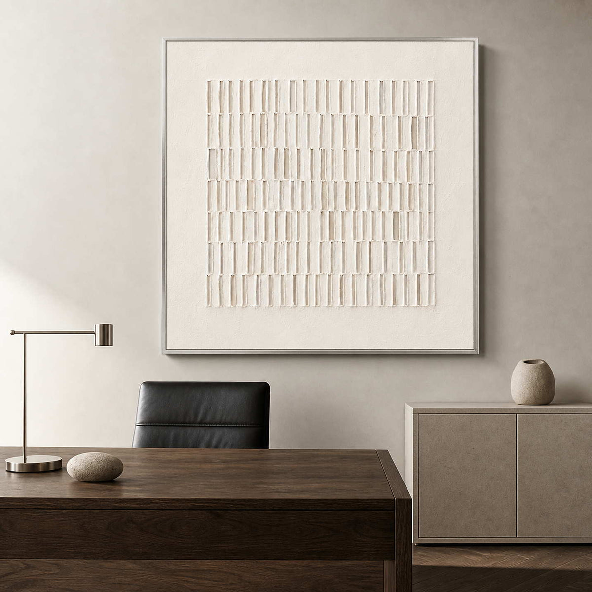 Ivory abstract wall art in a minimalist architect's office.