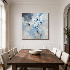 Square textured abstract art brings cool light to a modern dining room.