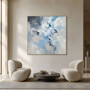 Textured winter-blue abstract canvas in a quiet contemporary gallery lounge.