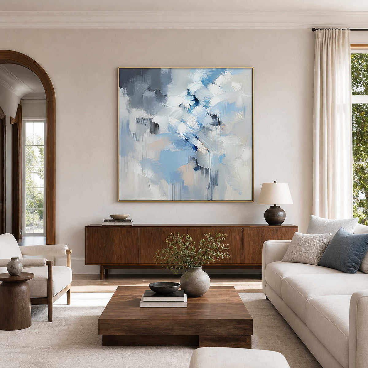 Icy blue, white, and gray square textured abstract wall art in a neutral living room.