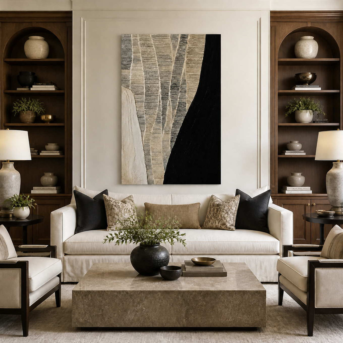 Frameless black and cream abstract artwork above a white sofa between wooden shelves.