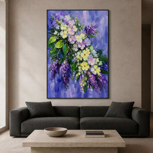 Lavender textured floral wall art above a charcoal modern living room sofa.