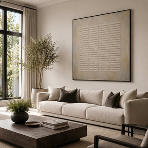 Neutral textured wall art styled in a living room.